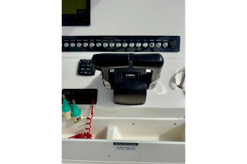 Slide: The Image of 2023 Key West 263 FS boat dashboard with Yamaha controls and switches. - 30