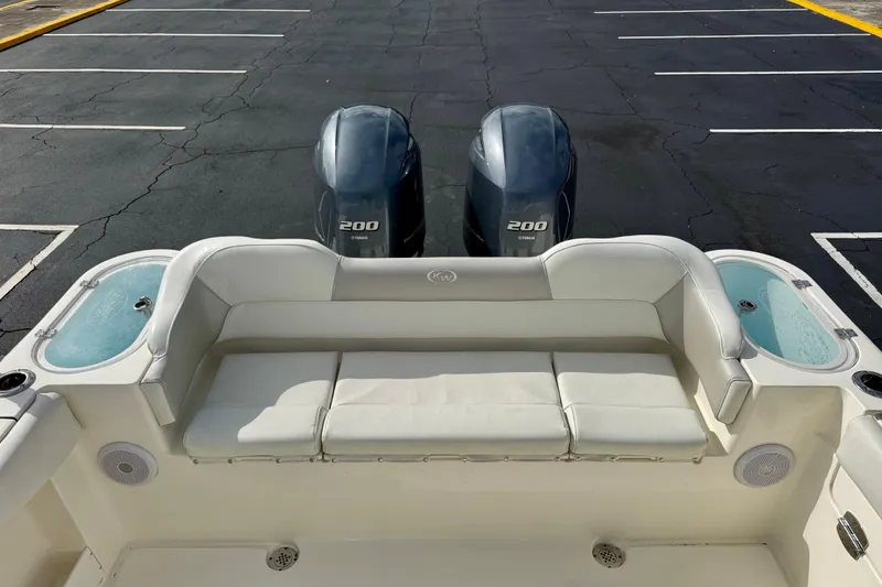 Slide: The Image of 2023 Key West 263 FS boat with twin Yamaha 200 engines and cushioned seating. - 36