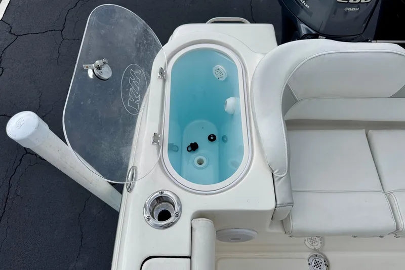 Slide: The Image of 2023 Key West 263 FS boat interior with open livewell and seating. - 38