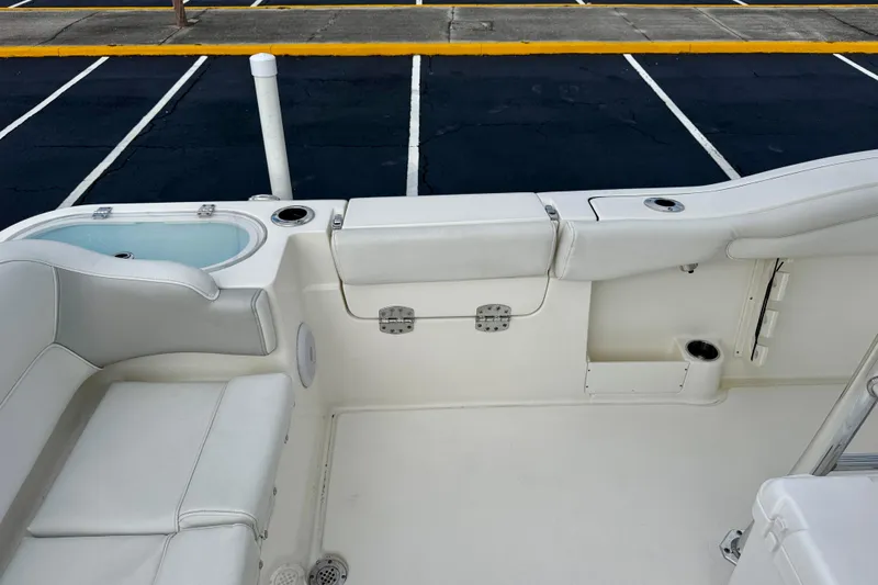 Slide: The Image of 2023 Key West 263 FS boat interior with seating and storage compartments. - 40