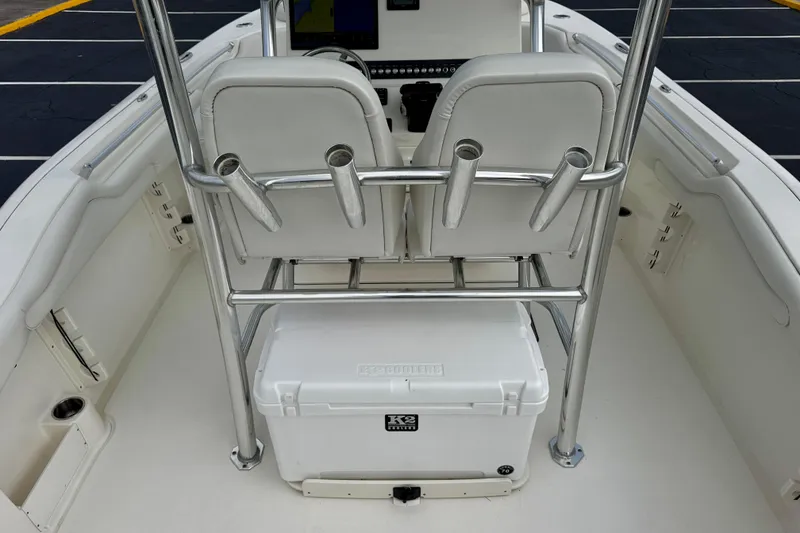 Slide: The Image of 2023 Key West 263 FS boat interior with seating and cooler. - 41