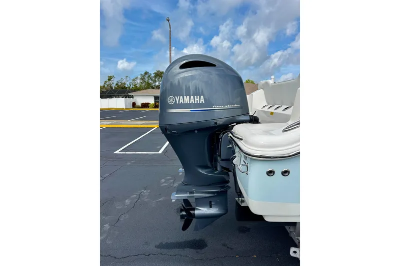 Slide: The Image of 2023 Key West 263 FS boat with Yamaha outboard motor in parking lot. - 44