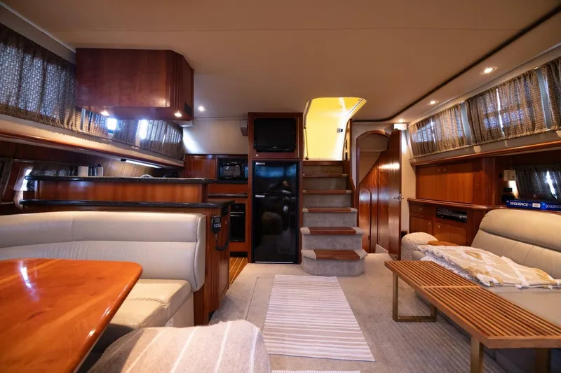 Slide: The Image of Luxurious interior of 2005 Cruisers Yachts 455 Express Motoryacht with elegant wood finishes. - 12