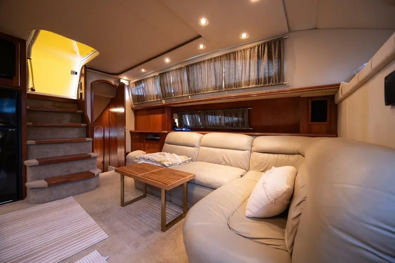 Slide: The Image of Luxurious interior of 2005 Cruisers Yachts 455 Express Motoryacht with plush seating and elegant decor. - 13