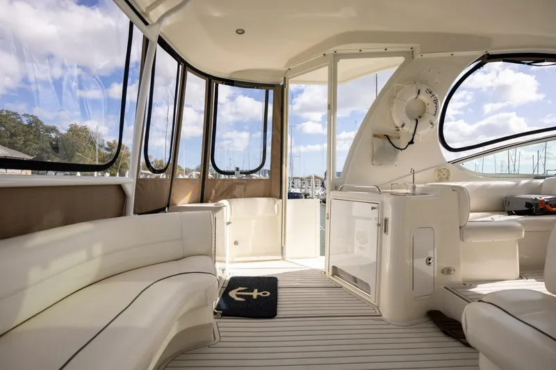 Slide: The Image of Luxurious interior of 2005 Cruisers Yachts 455 Express Motoryacht with elegant seating and panoramic windows. - 27