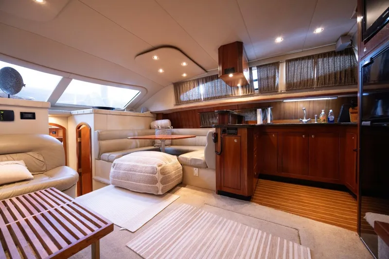 Slide: The Image of Luxurious interior of 2005 Cruisers Yachts 455 Express Motoryacht with elegant wood finishes. - 4