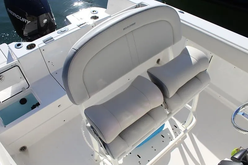Slide: The Image of 2025 Sailfish 232CC boat interior with cushioned seating and Mercury engine. - 3