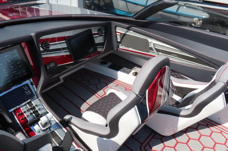 Slide: The Image of Luxurious interior of a 2016 MTI 48 boat with modern dashboard and seating. - 33