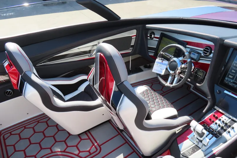 Slide: The Image of Luxurious 2016 MTI 48 boat interior with modern dashboard and sleek seating design. - 38