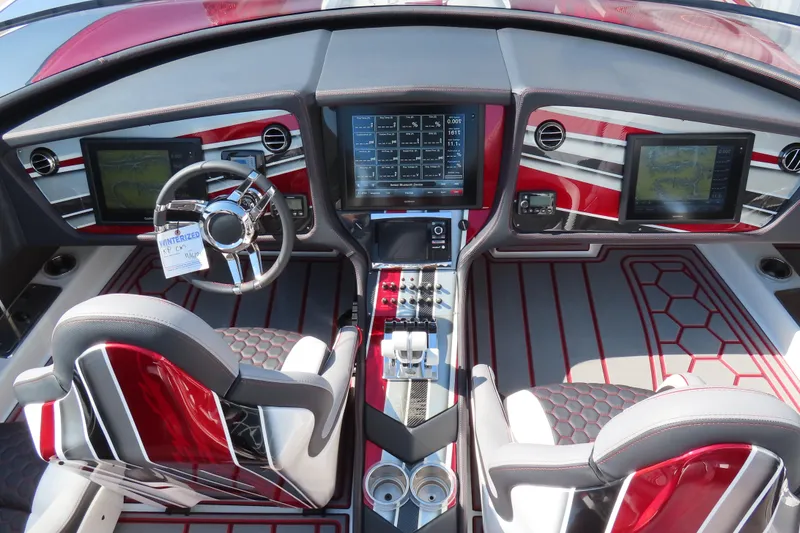 Slide: The Image of Luxurious 2016 MTI 48 boat cockpit with advanced navigation screens and sleek design. - 42