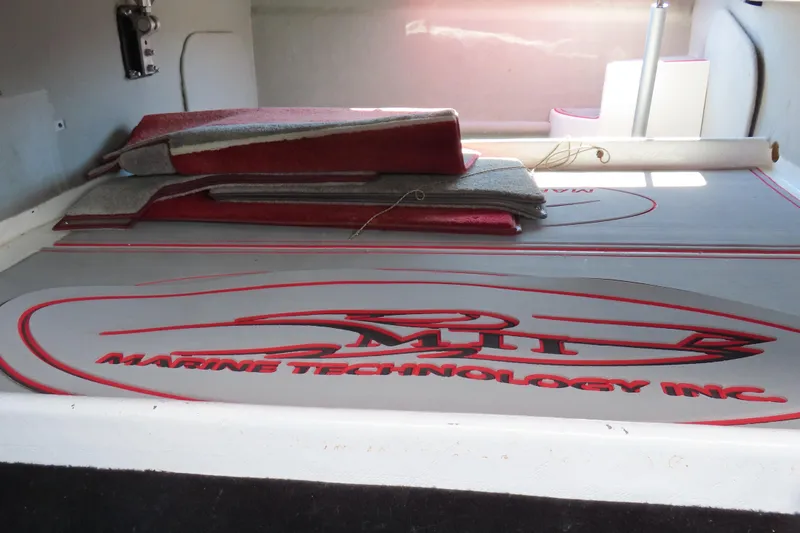 Slide: The Image of MTI 48 boat interior with Marine Technology Inc. logo, 2016 model. - 43