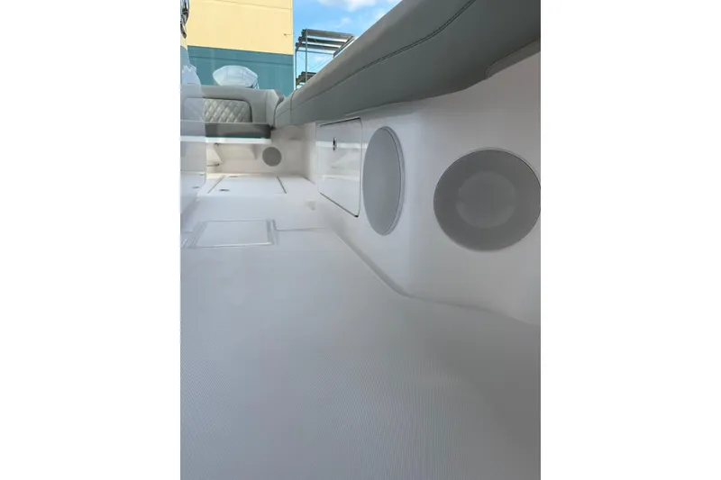 Slide: The Image of 2026 Mag Bay 43 CC boat on calm water under clear blue sky. - 10