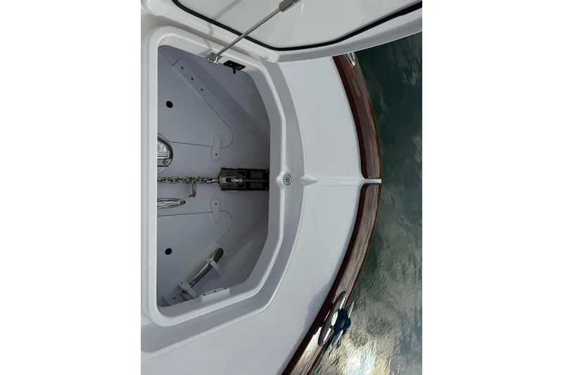 Slide: The Image of 2026 Mag Bay 43 CC boat interior on calm water at sunset. - 27