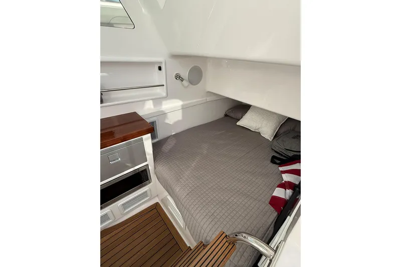 Slide: The Image of 2026 Mag Bay 43 CC boat interior with sleek design and advanced controls. - 28