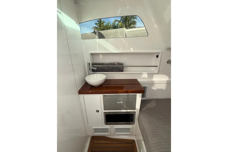 Slide: The Image of 2026 Mag Bay 43 CC boat interior with luxurious seating and advanced navigation system. - 29