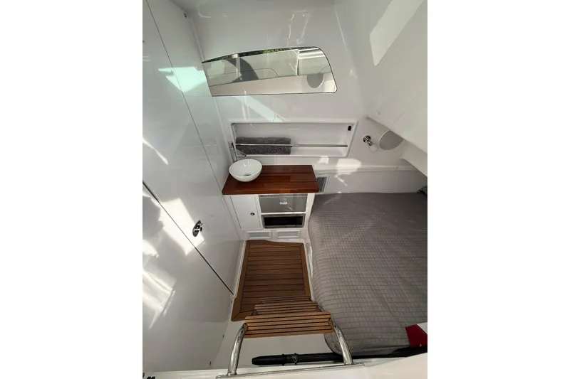 Slide: The Image of Interior view of 2026 Mag Bay 43 CC boat cockpit with advanced navigation displays. - 30