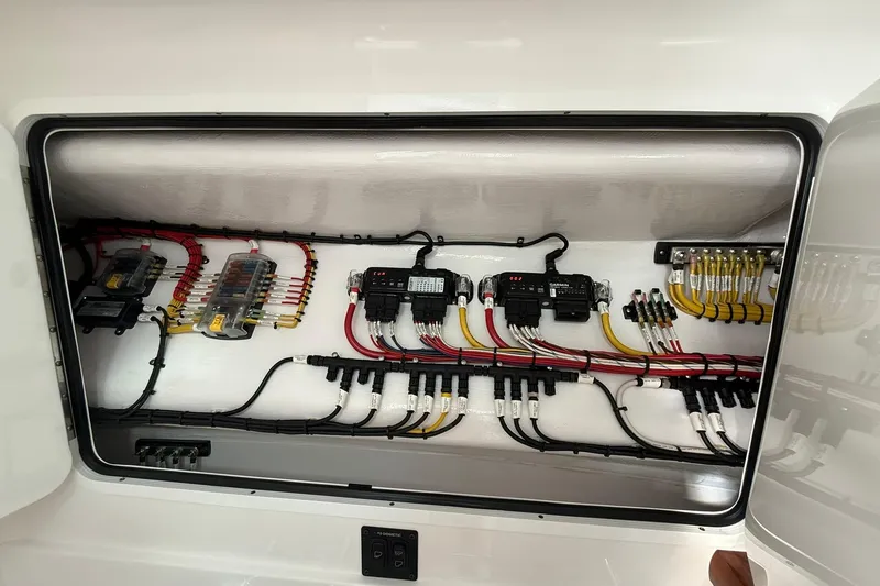 Slide: The Image of 2026 Mag Bay 43 CC cabin interior with bed, wooden steps, and modern design. - 38