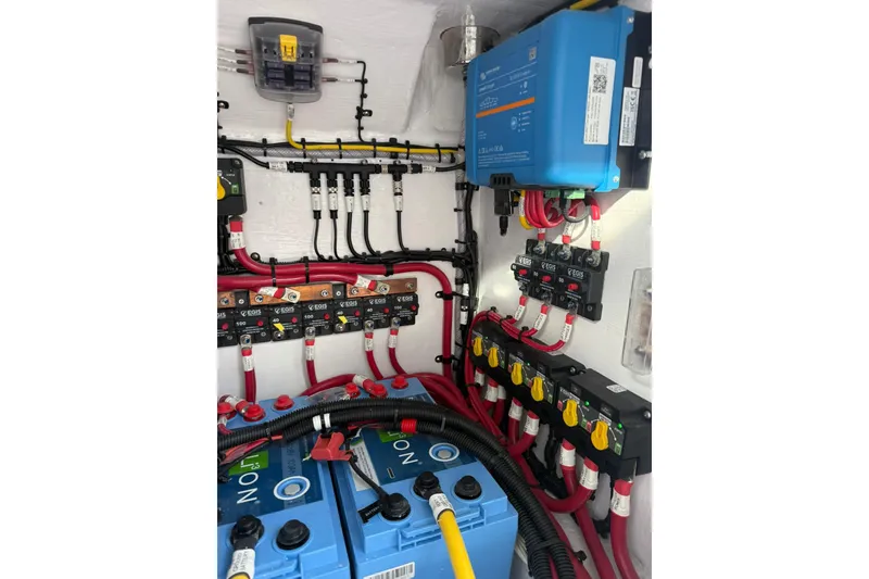 Slide: The Image of 2026 Mag Bay 43 CC boat interior wiring and storage compartment. - 39