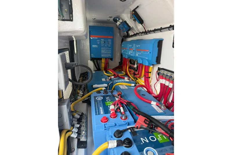 Slide: The Image of Interior of 2026 Mag Bay 43 CC boat with modern amenities and wooden accents. - 41