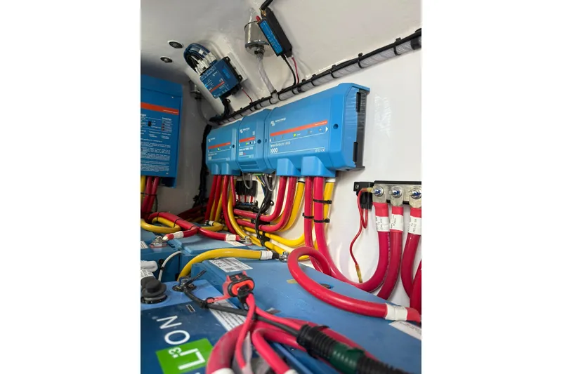 Slide: The Image of Interior of 2026 Mag Bay 43 CC boat with modern amenities and wooden accents. - 43