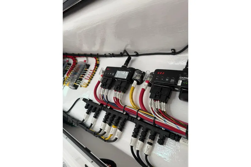 Slide: The Image of Electrical panel inside 2026 Mag Bay 43 CC boat, showcasing wiring and components. - 45