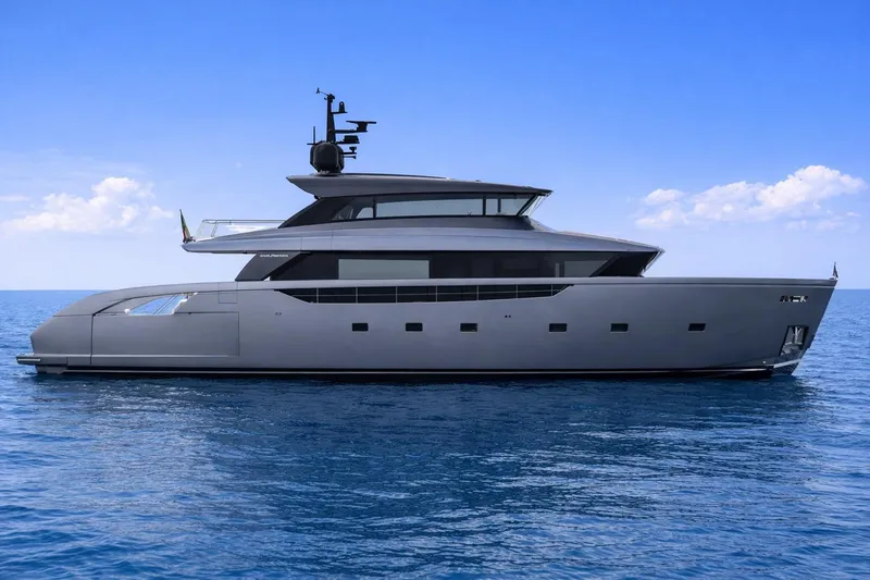 Slide: The Image of 2026 Sanlorenzo SX100 yacht on calm blue ocean under clear sky. - 2