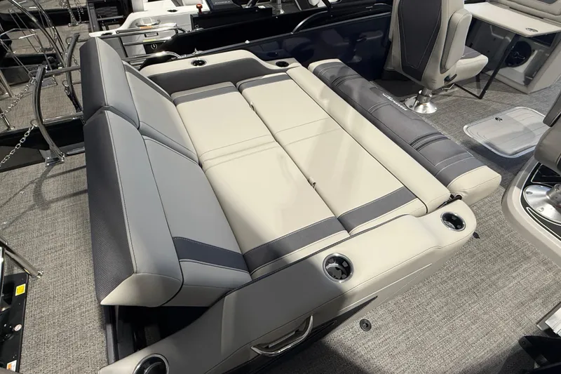 Slide: The Image of 2025 Barletta CORSA 25UC boat interior with luxurious seating and cup holders. - 4