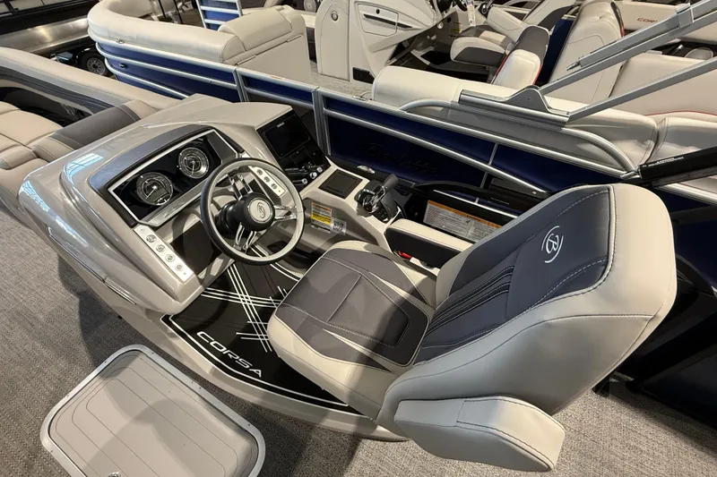 Slide: The Image of 2025 Barletta CORSA 25UC boat interior with modern steering console and luxurious seating. - 7