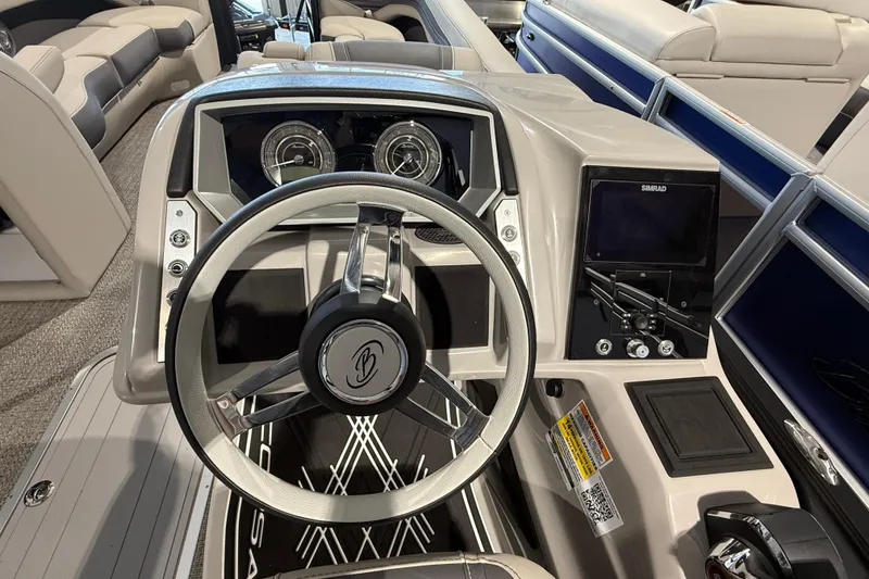 Slide: The Image of 2025 Barletta CORSA 25UC boat dashboard with steering wheel and control panel. - 8