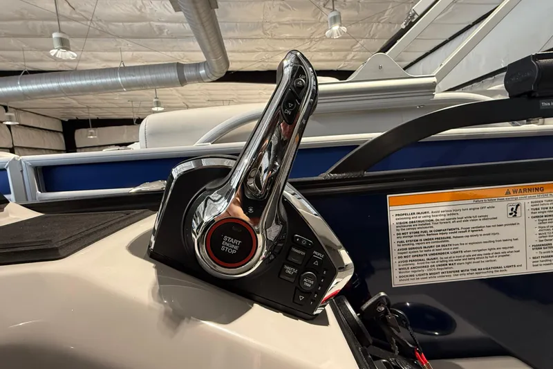 Slide: The Image of Throttle control of 2025 Barletta CORSA 25UC boat with start/stop button. - 9
