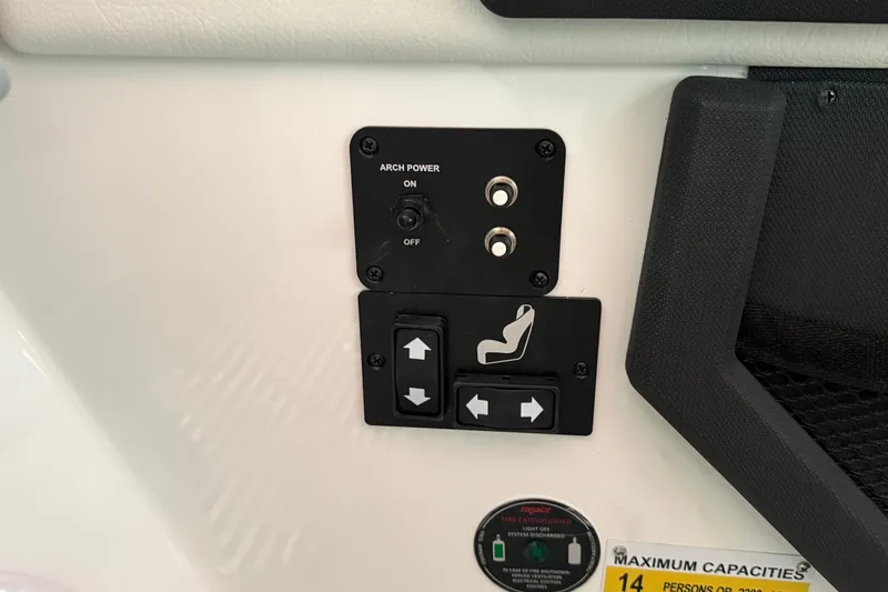 Slide: The Image of Control panel of 2025 Cobalt R6 boat with seat adjustment and arch power switches. - 13