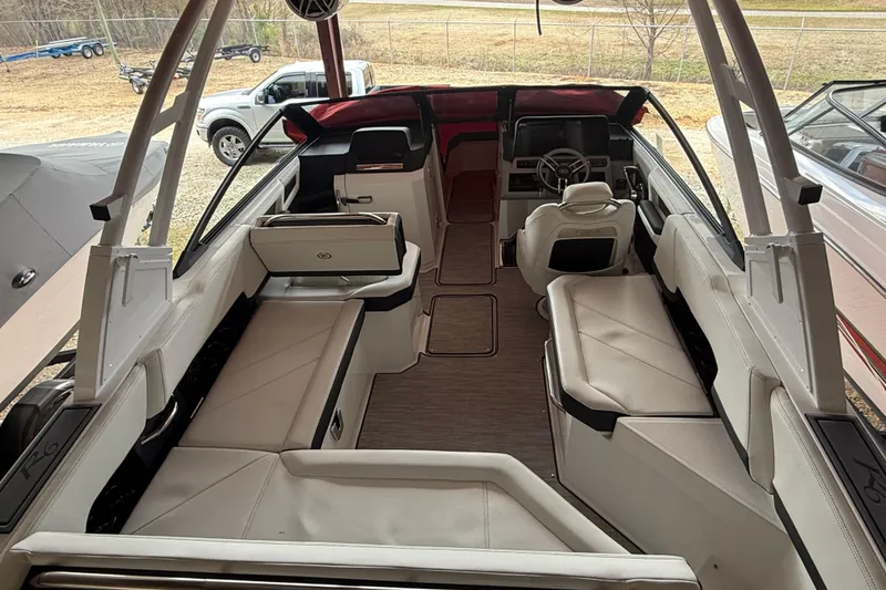 Slide: The Image of 2025 Cobalt R6 boat interior with luxurious seating and modern dashboard design. - 18