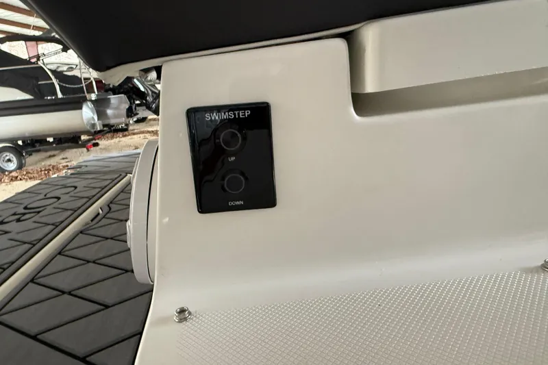 Slide: The Image of 2025 Cobalt R6 swim step control panel with up and down buttons. - 20