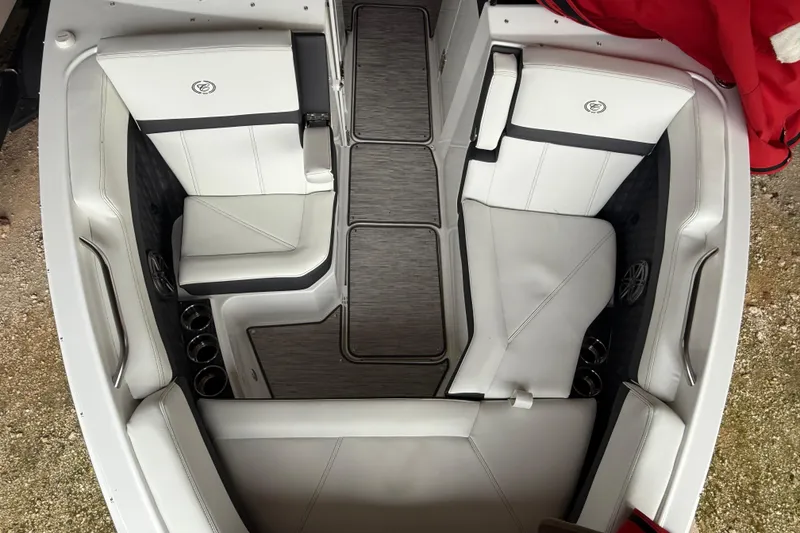 Slide: The Image of 2025 Cobalt R6 boat interior with white seating and modern design. - 21