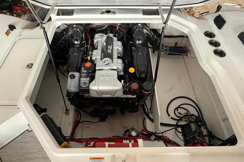 Slide: The Image of 2025 Cobalt R6 boat engine compartment with V8 engine and visible components. - 6