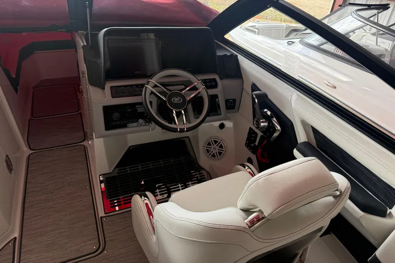 Slide: The Image of 2025 Cobalt R6 boat interior with modern steering and dashboard controls. - 7