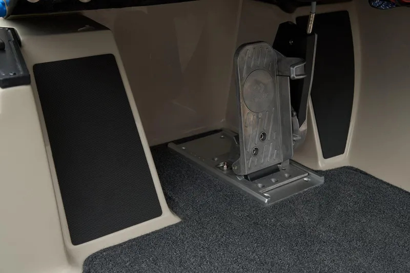 Slide: The Image of Manufacturer Provided Image: 2026 Ranger Z185 boat foot pedal and carpeted interior detail. - 43