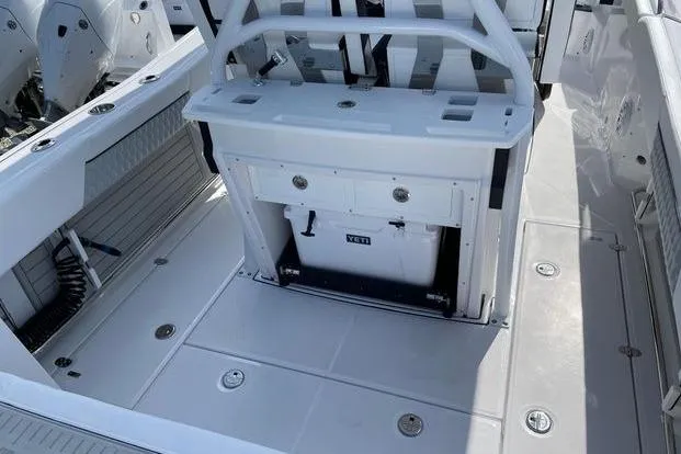 Slide: The Image of 2026 Blackfin 272 CC boat deck with seating and storage area. - 10