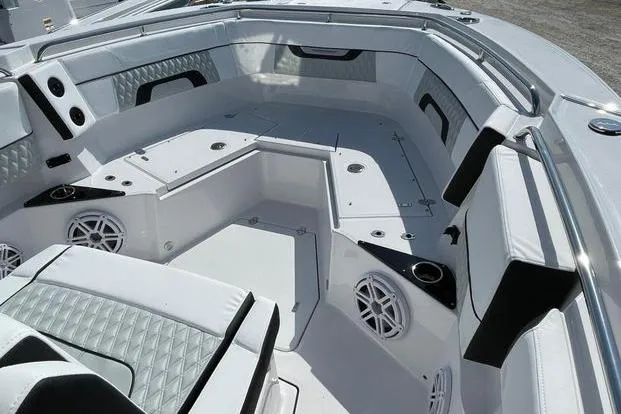 Slide: The Image of 2026 Blackfin 272 CC boat interior with modern seating and speaker system. - 3