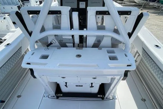 Slide: The Image of 2026 Blackfin 272 CC boat interior with advanced Garmin navigation system. - 8