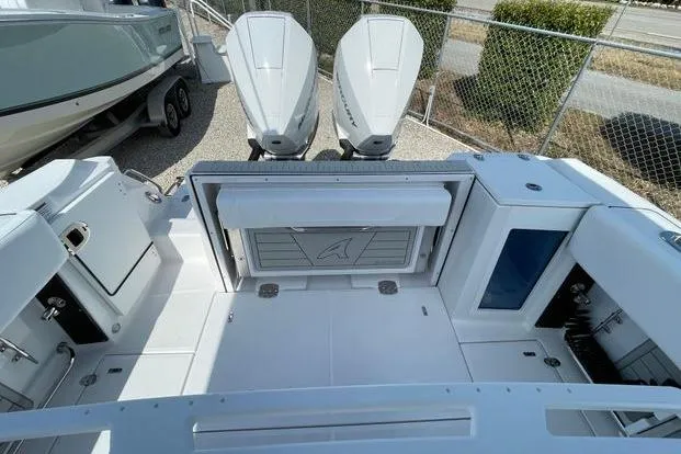 Slide: The Image of 2026 Blackfin 272 CC boat deck with dual outboard engines, spacious layout. - 9
