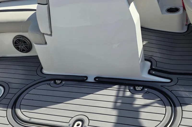 Slide: The Image of 2022 Starcraft MDX 191 E O/B boat interior with sleek flooring and speaker detail. - 10