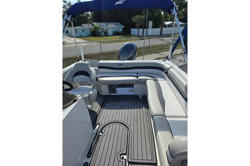 Slide: The Image of 2022 Starcraft MDX 191 E O/B boat interior with gray seating and flooring. - 18