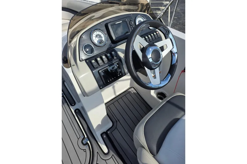 Slide: The Image of 2022 Starcraft MDX 191 E O/B boat dashboard with steering wheel and controls. - 20