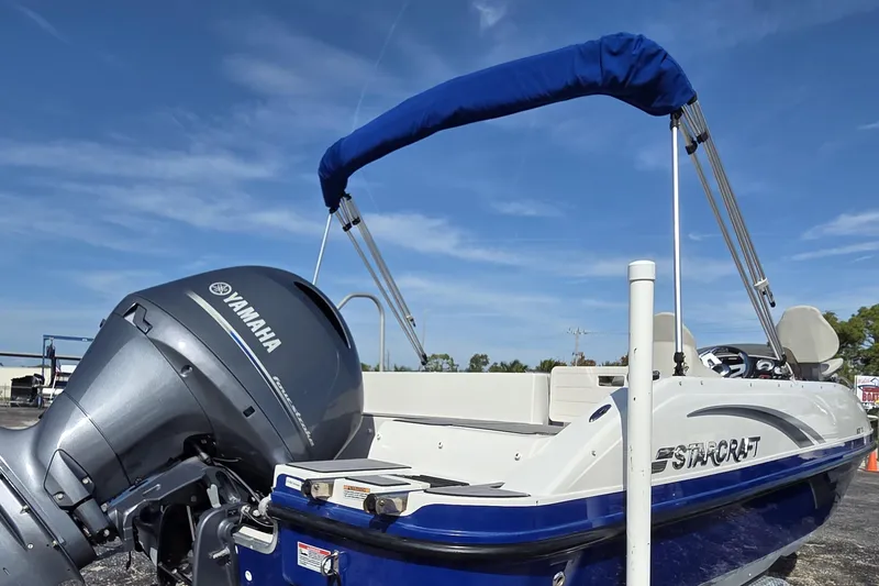 Slide: The Image of 2022 Starcraft MDX 191 E O/B boat with Yamaha outboard motor under blue sky. - 3