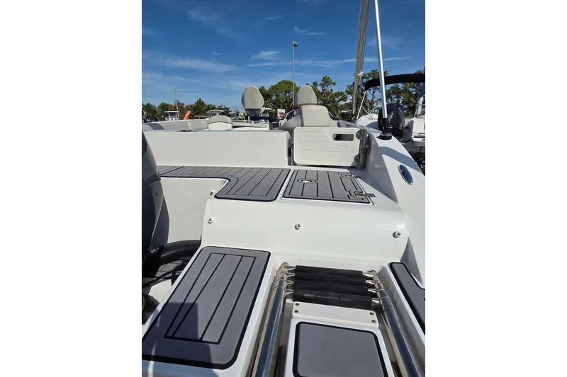Slide: The Image of 2022 Starcraft MDX 191 E O/B boat interior with sleek deck design. - 4