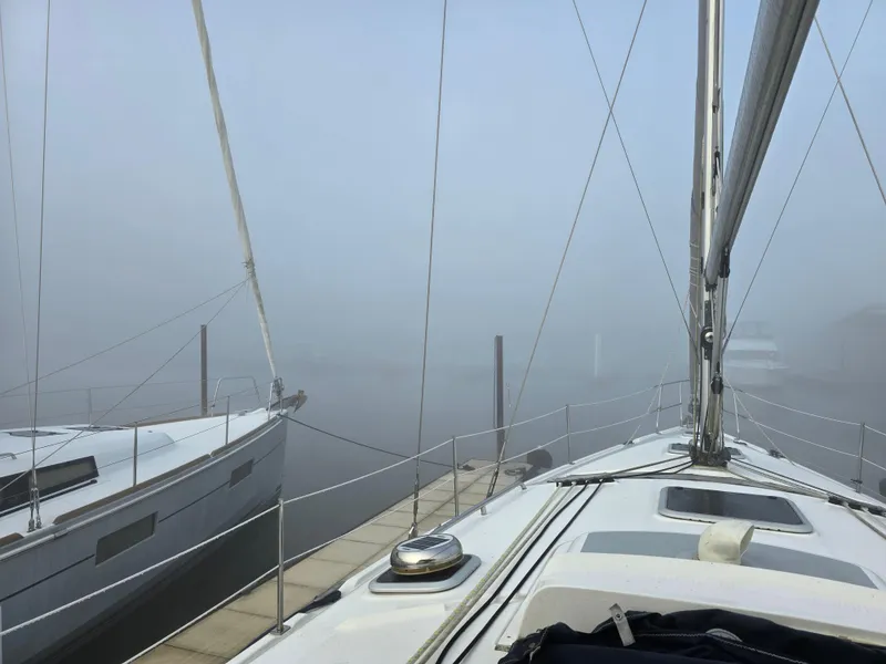 Slide: The Image of Foggy marina view from a 2004 Hunter 41 AC sailboat deck. - 10
