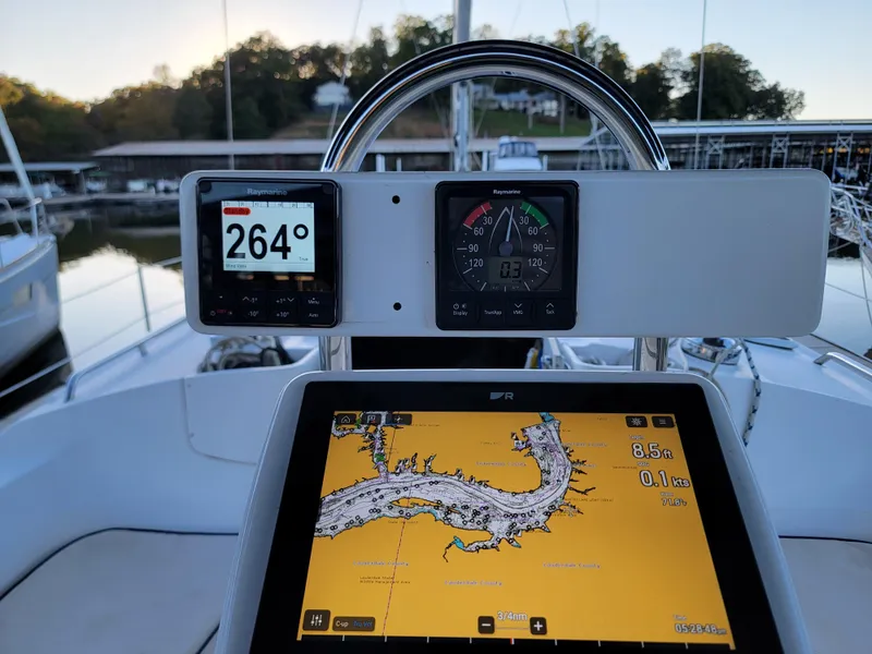 Slide: The Image of Cockpit of 2004 Hunter 41 AC sailboat with navigation instruments and digital map display. - 19
