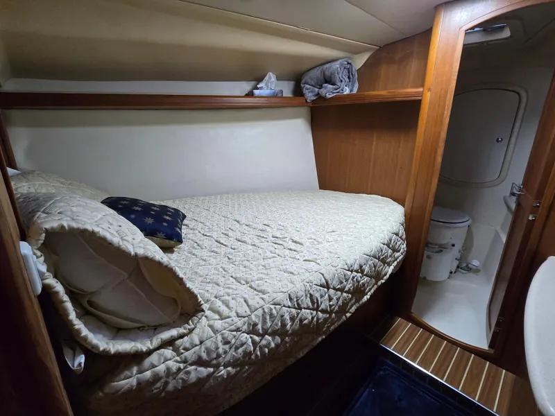 Slide: The Image of Cozy cabin interior of 2004 Hunter 41 AC sailboat with bed and private bathroom. - 32