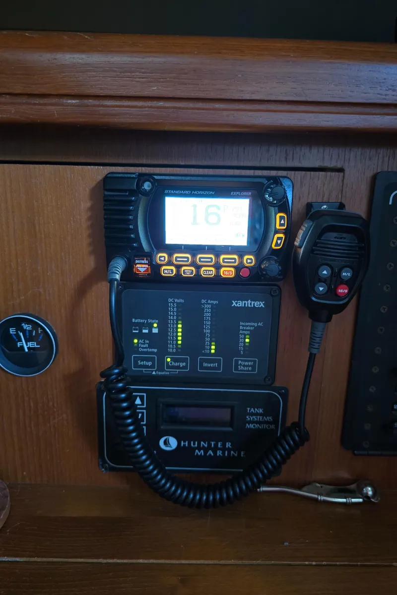 Slide: The Image of Hunter 41 AC 2004 marine radio and control panel with microphone and display. - 39